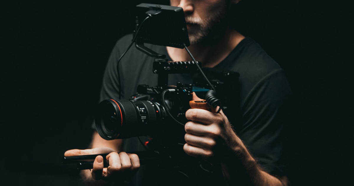 How to leverage your videos - photo of man with a camera by pexels-kyle-loftus