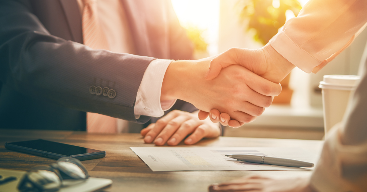insurance agent shaking hand of a referral source